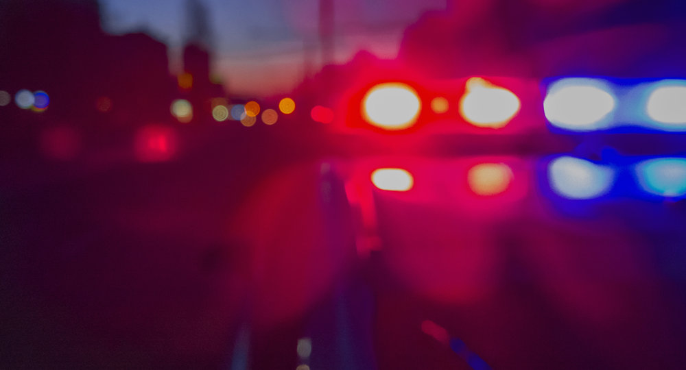 Red and blue Lights of police car in night time. abstract blurry image